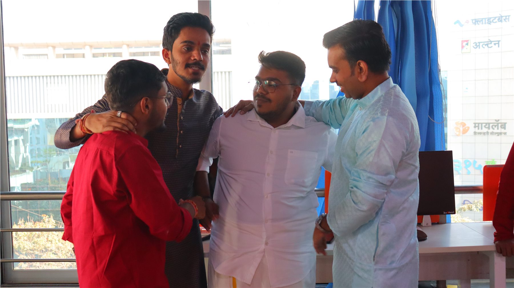 TechnoEdge colleagues sharing a candid moment at the office