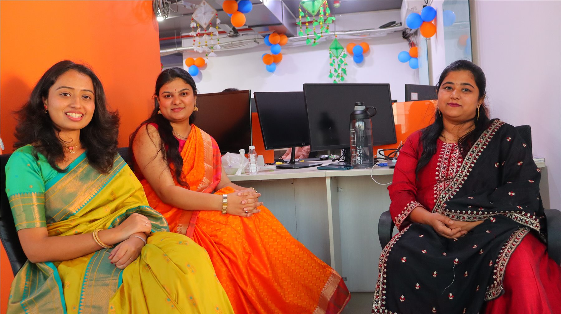 TechnoEdge team members celebrating in traditional attire