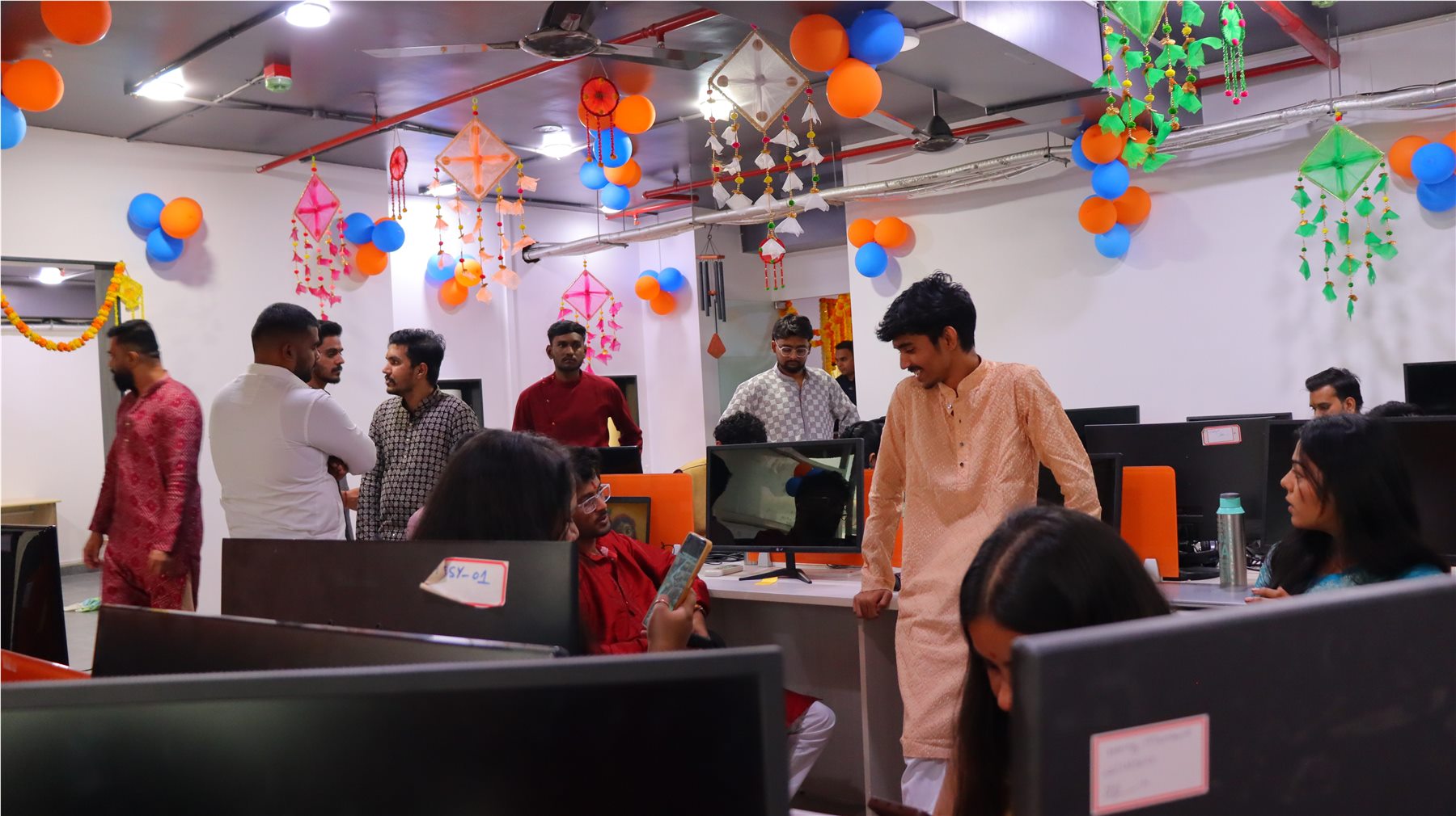 TechnoEdge colleagues celebrating together in the office