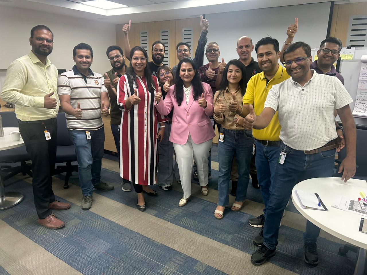 Corporate workshop participants celebrating their learning
